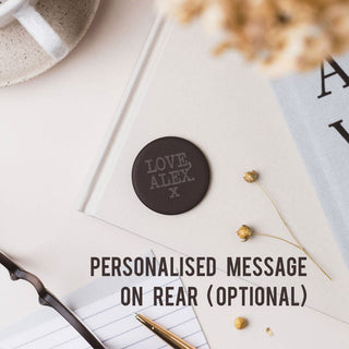 Personalised pocket hug slate token gift displayed on a book