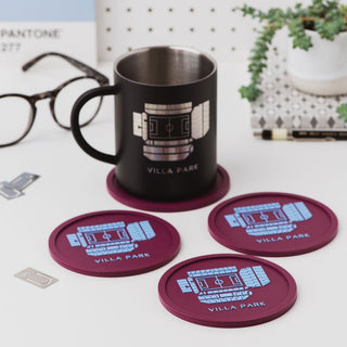 Set of four Aston Villa Villa Park stadium coasters on a desk with a mug, football-themed gift for Aston Villa fans.