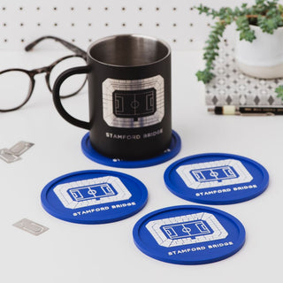 Chelsea FC Stamford Bridge football stadium coaster under a mug on a desk, showing a washable and durable football gift for men.