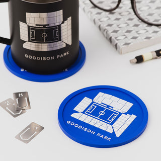 Everton Goodison Park football stadium coaster on desk, featuring raised blue silicone design by Iconic Coasters, football gift for men