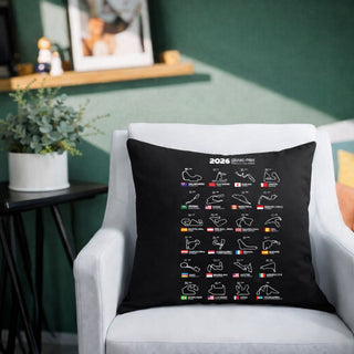 Black Formula 1 2026 Grand Prix track calendar cushion displayed on a white armchair in a modern living room