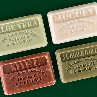 Aloe Vera  Argan Oil  Olive Oil  Honey french soap flat lay