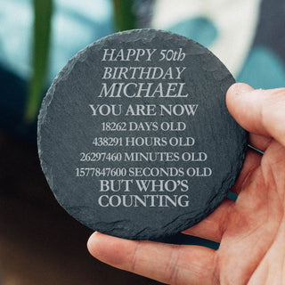 Funny personalised 50th birthday slate coaster with custom name showing age in days hours minutes and seconds milestone gift