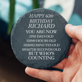 Funny personalised 60th birthday slate coaster with custom name showing age in days hours minutes and seconds milestone gift