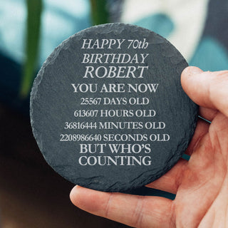Funny personalised 70th birthday slate coaster with custom name showing age in days hours minutes and seconds milestone gift