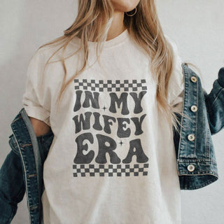 Woman wearing "In My Wifey Era" bridal graphic t-shirt in premium cotton
