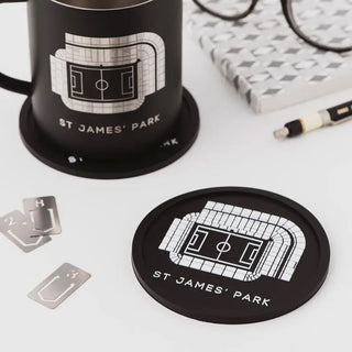 Close-up of a Newcastle United St James’ Park football stadium coaster showing the detailed stadium design on a black, water resistant coaster.
