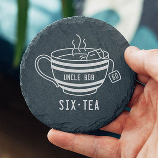 Personalised engraved slate tea coaster for a 60th birthday with teacup illustration and Six-Tea milestone pun design.