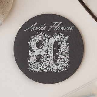 Round black engraved slate coaster with floral 80 and personalised text 