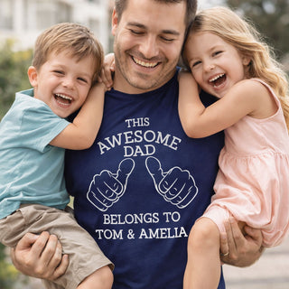 Personalised awesome dad t-shirt with children’s names worn by dad holding kids