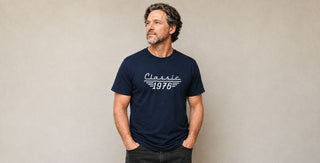 Man wearing a personalised birth year T-shirt in navy blue, custom birthday gift for milestone birthdays