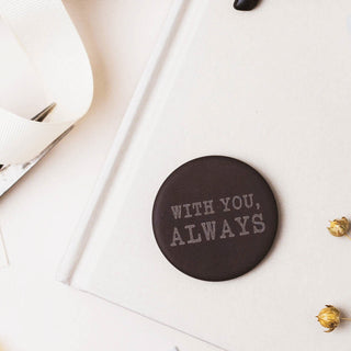 Personalised pocket hug slate token gift displayed on a book