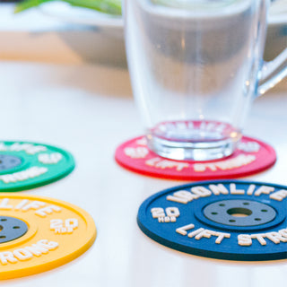 Colorful silicone mug coasters that look like mini weight plates