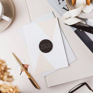 Personalised pocket hug slate token gift displayed on card with stationery and styling